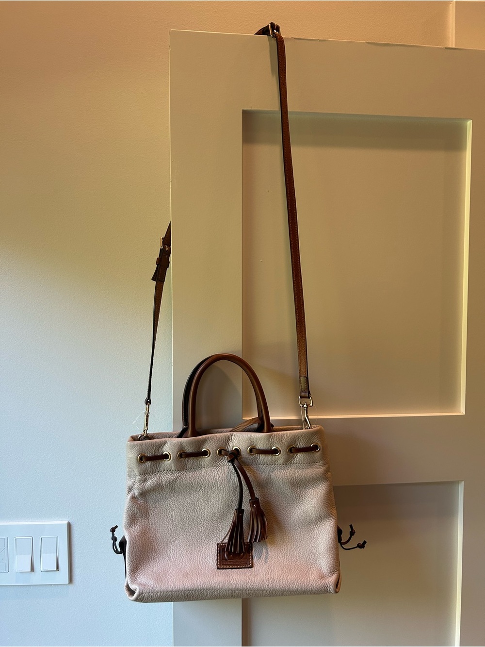 Dooney and Bourke Cream and Brown Leather Drawstring Shoulder Bag with Tassel